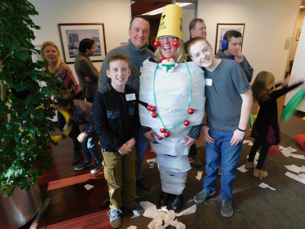 human Christmas tree with family