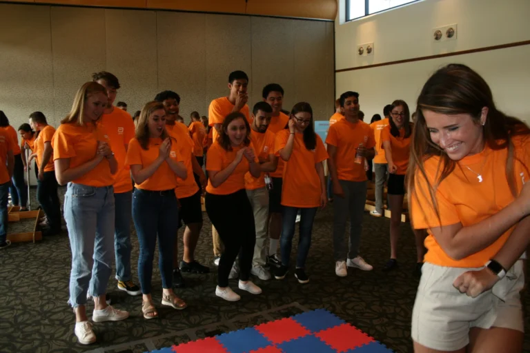 Summer Interns smiling while engaging in a team building activity