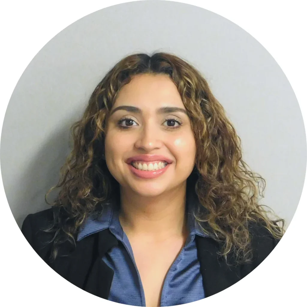 Person with curly hair in blazer